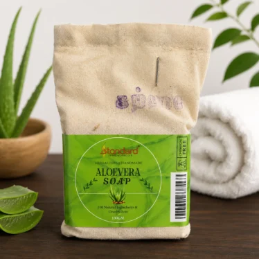 Herbal handmade aloe vera soap in eco-friendly cloth packaging with aloe vera slices and natural background