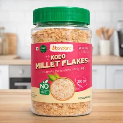 Kodo millet flakes jar placed on kitchen counter, healthy South Indian breakfast ingredient, varagu aval product