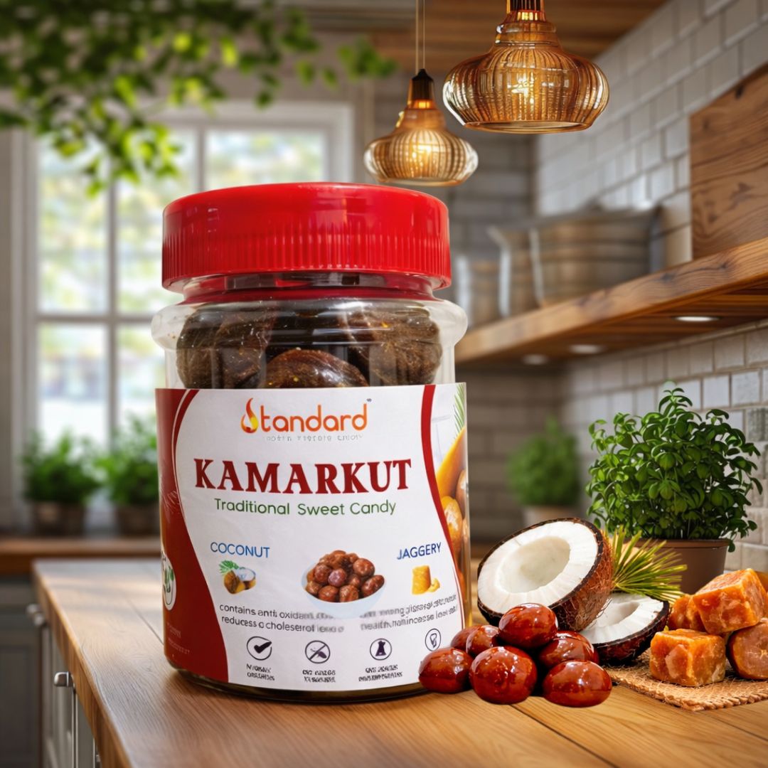 Kamarkut traditional sweet candy made with coconut and jaggery in a jar placed on a kitchen table