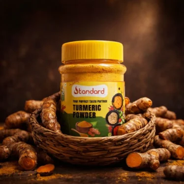 Premium turmeric powder jar placed in basket with fresh turmeric roots – natural Indian spice product