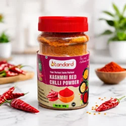 Kashmiri red chilli powder jar with whole dried chillies, natural spice product