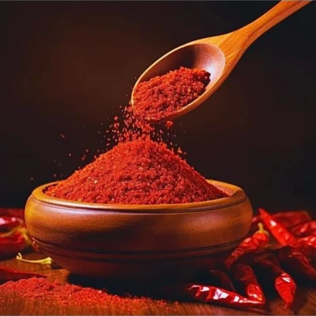 Kashmri Red Chilli Powder 100G 2 Close-Up Of Pure Red Chilli Powder In Wooden Bowl With Spoon And Dried Chillies