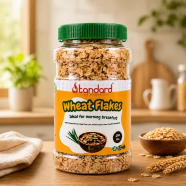 Happy family enjoying healthy wheat flakes breakfast with milk – high fiber cereal for kids and adults