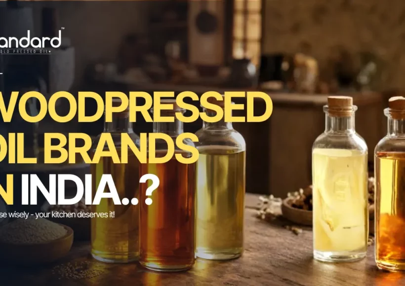 Best Wood Pressed Oil Brands In India Displayed In Glass Bottles With Rustic Kitchen Background, Highlighting Pure Traditional Cold Pressed Oils.