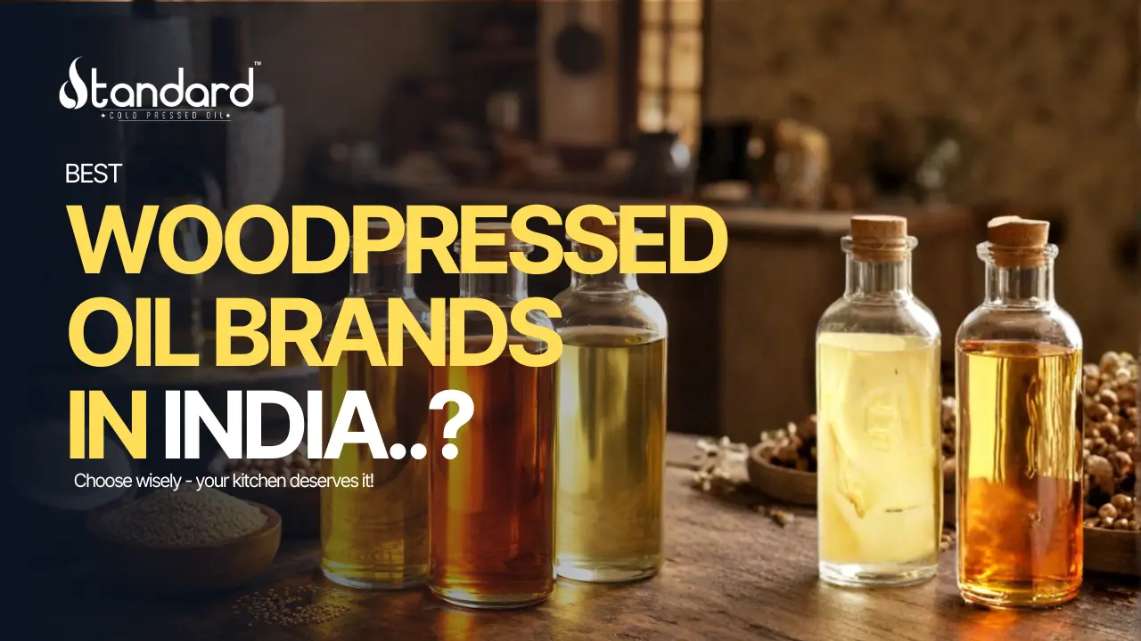 Best Wood Pressed Oil Brands In India Displayed In Glass Bottles With Rustic Kitchen Background, Highlighting Pure Traditional Cold Pressed Oils.